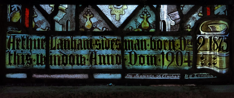 Inscription at base of right-hand light