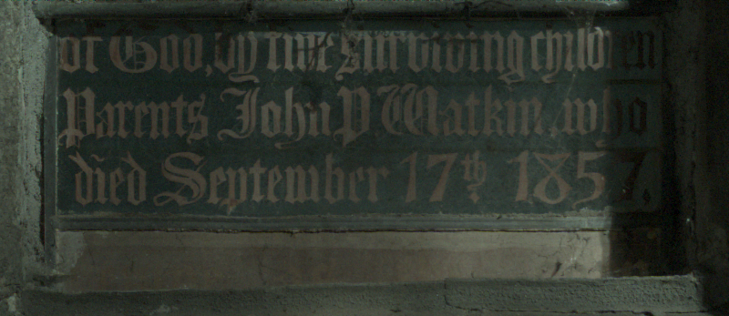Inscription at the base of b