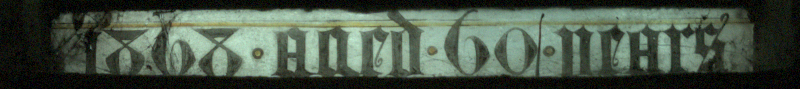 Inscription at base of d